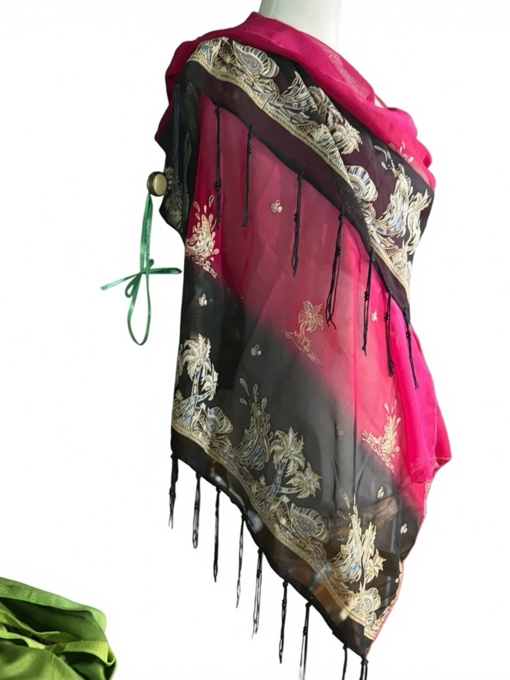 magenta and black scarf features palm tree motifs and black tassels along the ed